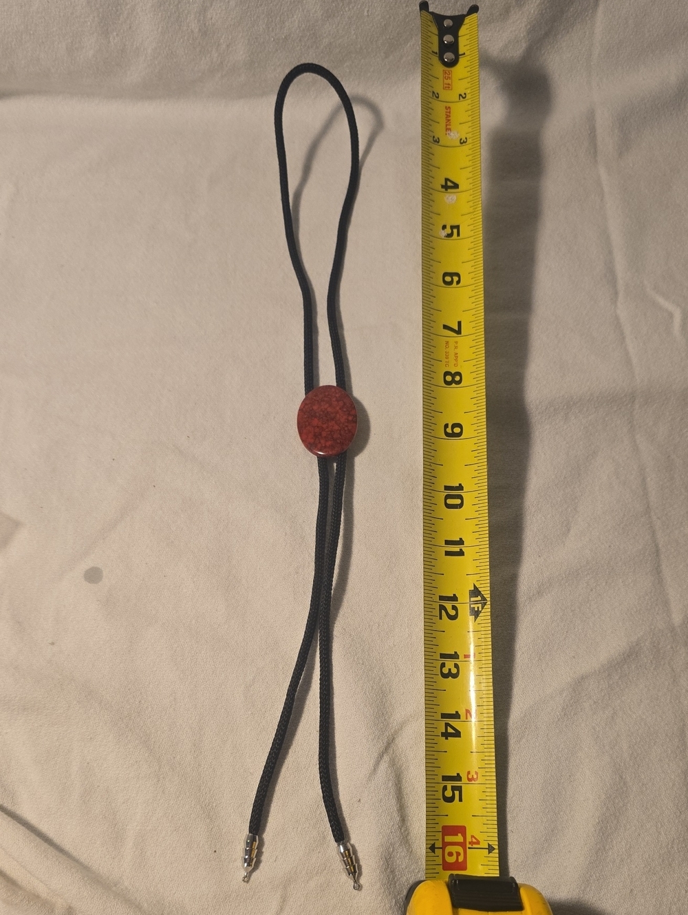Adjustable Black Cord Bolo Tie with Red Stone Accent